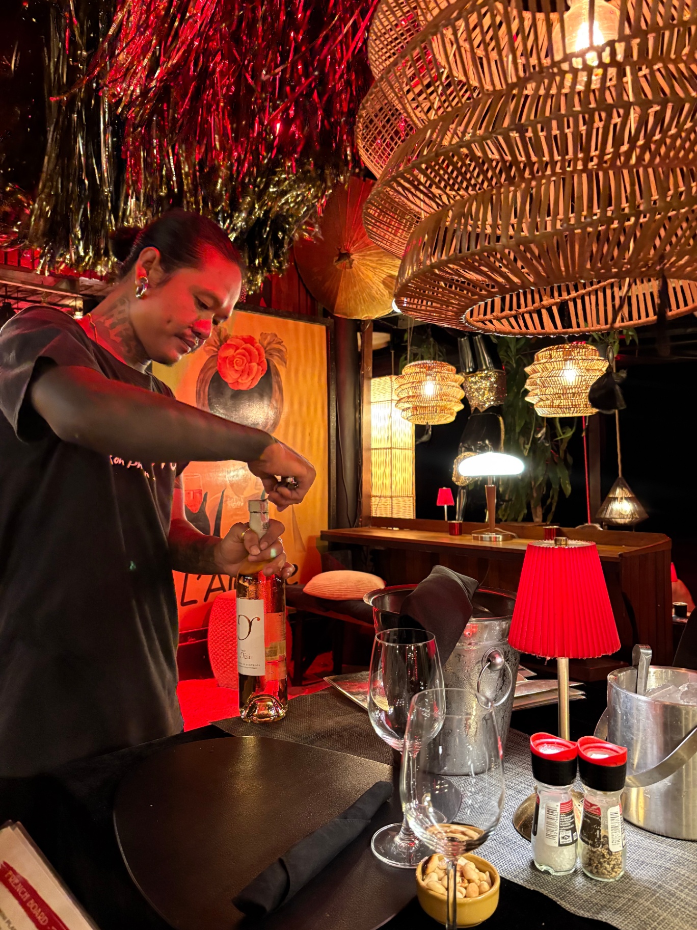 Uncorking a bottle of rosé at the table